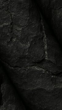 Industrial Metallurgical Coke Coal sample rotating in close up view to reveal porous gray carbon structure created for steel production smelting process