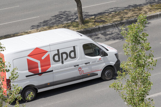 Dpd electric delivery van driving on city street