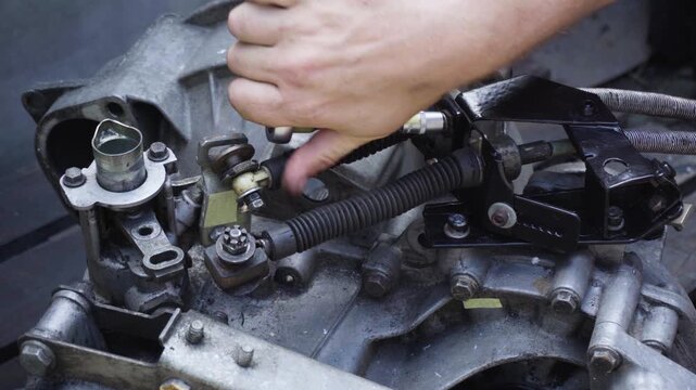 old gear shift box from a front-wheel drive car installing cables and shifting gears disassembly for repair