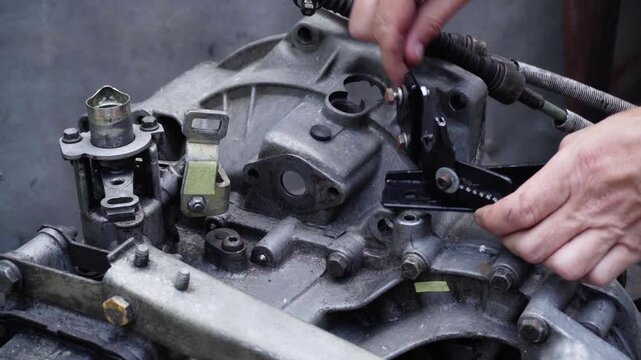 old gear shift box from a front-wheel drive car installing cables and shifting gears disassembly for repair