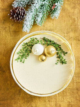 Holiday dessert plate with decorative ornaments and herbs, seasonal celebration concept for menu or event planning