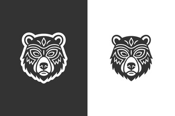 Obraz premium Two stylized bear head illustrations with tribal patterns on black and white backgrounds