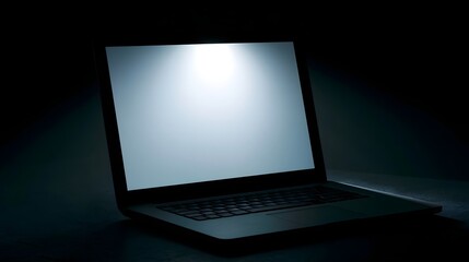 Fototapeta premium A high tech laptop is illuminated by soft ambient light creating a futuristic and minimalist mood