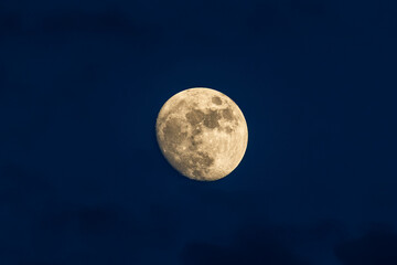 Fototapeta premium Detailed waxing gibbous moon against deep blue evening sky, Italy, Roseto degli Abruzzi, 28 May 2026