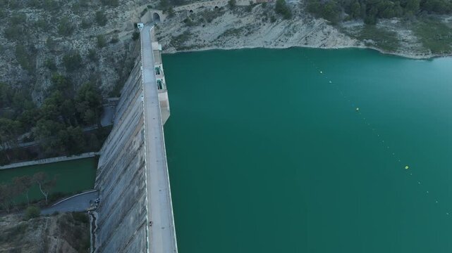 Panoramic aerial shot of a large water dam and reservoir landscape