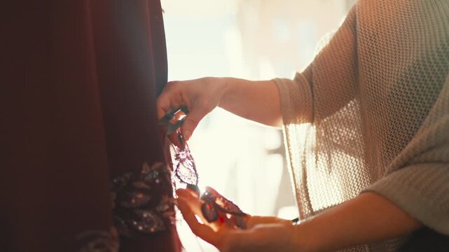 Tailoring a dress for a special occasion in a bright workshop space during the day
