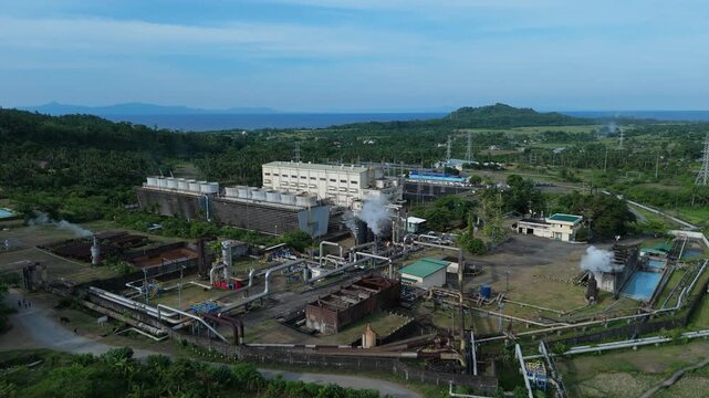 Geothermal plant in Tabaco City, Philippines with steam and pipes. Renewable energy. Ideal for industrial and business concept.