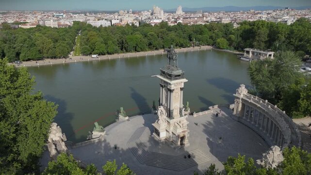 Orbit aerial view of Alfonso XII monument in Retiro Park Madrid