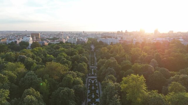 Aerial view of El Retiro park and Madrid skyline at sunset