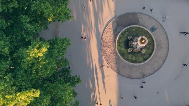Top down zenith aerial view of a classic stone fountain in Madrid Retiro Park