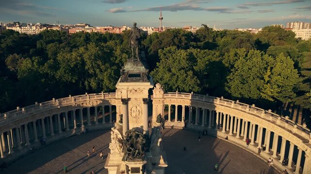 High angle tracking shot closing in on the equestrian statue of King Alfonso XII monument in Retiro Park