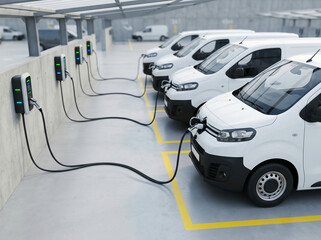 Naklejka premium Row of Identical White Electric Delivery Vans Charging at Wall-Mounted Stations in Parking Structure