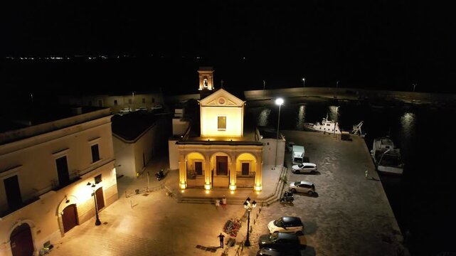 Gallipoli at night &ndash; Italy, Apulia &ndash; rotating aerial shot around the church Santuario di Santa Maria del Canneto with panoramic view