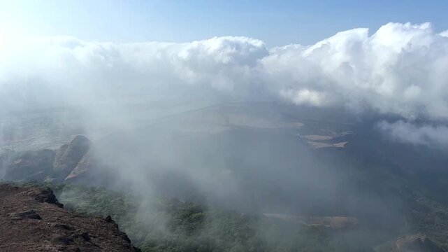Thick cloud formation and movement seen from the top of Harishchandragad near Malshej, Maharashtra.