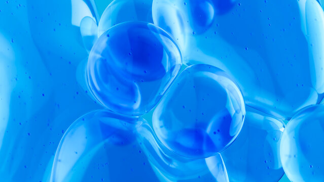 Abstract arrangement of blue spheres in 3D liquid glass on background