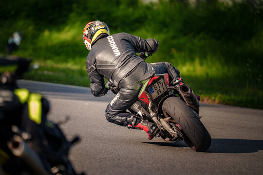 Regular training in Riga, Latvia, Bikernieki on 12-05-2026  Motorcyclist leaning into a curve on a winding road