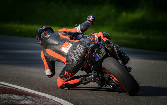 Regular training in Riga, Latvia, Bikernieki on 12-05-2026  Racing Motorcyclist Navigating a Curve on Track