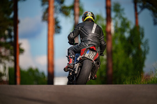 Regular training in Riga, Latvia, Bikernieki on 12-05-2026  Motocross rider jumping on dirt track in forest