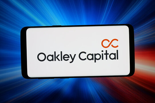 Stuttgart, Germany - 06-08-2026: In this photo illustration, the logo of investment company Oakley Capital Limited is displayed on a smartphone in front of abstract background on computer screen.