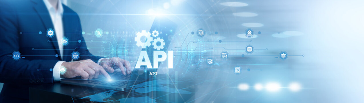 Software developer working on laptop. API integration and development. Programmer connecting diverse software systems and data sharing protocols. Efficient backend connectivity and interface.