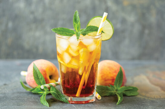 Ice tea with lime and mint in the glass	