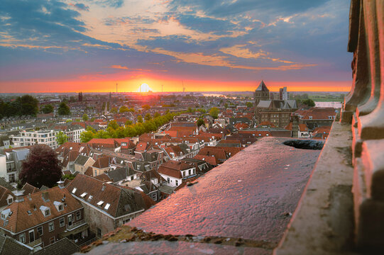 Sundown sky paints ancient rooftops in warm, fading light.