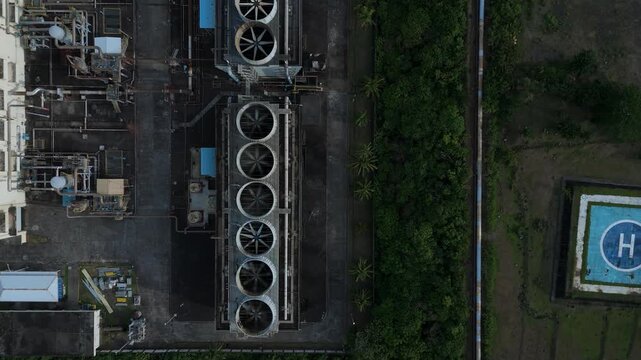 Drone shot reveals cooling towers of the Geothermal Power Plant in Tabaco City, Philippines. Ideal for educational and corporate videos.