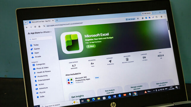 Closeup of a laptop screen displaying the apple app store page for microsoft excel, showing app details, rating, and download information
