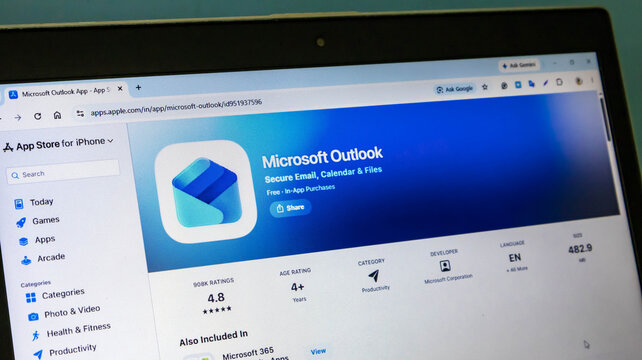 Closeup of a laptop screen displaying the apple app store page for the microsoft outlook mobile application for iphone