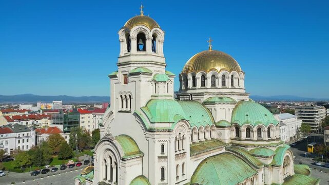 Aerial view of the majestic St. Alexander Nevsky Cathedral in Sofia, Bulgaria. Neo Byzantine architecture with golden domes against a blue sky