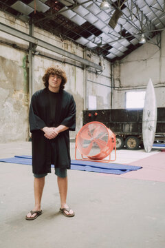 Man Stands confident in Industrial Space 