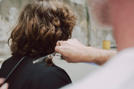 Close up hairdresser Cut Curly Hair 