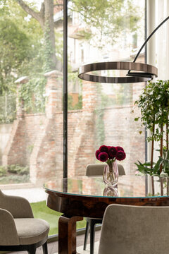 Modern dining space with sculptural floor lamp