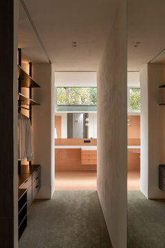 Walk-in wardrobe leading to bathroom
