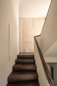 Minimal staircase with aged wall texture