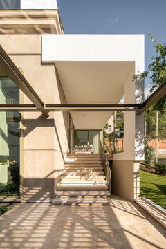 Minimalist entrance with geometric staircase