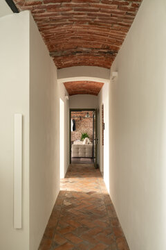 Narrow hallway with brick vaulted ceiling