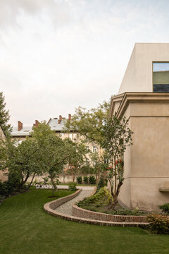 Curved garden path beside modern house