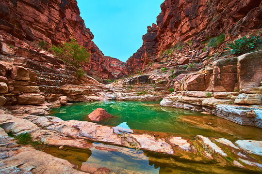 Turquoise Pool and Red Rock Canyon Walls in Remote Havasupai Arizona Landscape