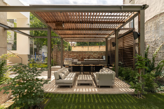 Outdoor lounge under wooden pergola