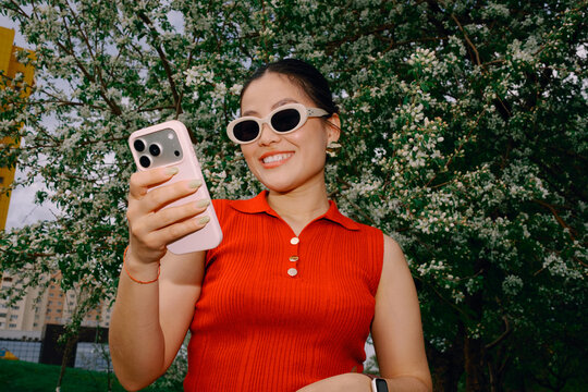 Woman using smartphone outdoors