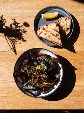 Steamed Mussels With Chili And Herbs Served With Grilled Sourdou