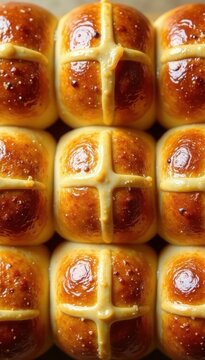 Close-up overhead view of golden-brown hot cross buns, Easter treat , hot cross buns, sweet