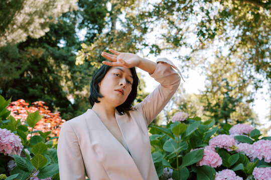 Non-binary model in pink blazer 2