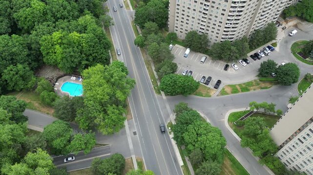 Aerial shot of Mississauga, Ontario, Canada on an overcast summer afternoon. Overhead shot looking down on Mississauga Valley Boulevard, along a stretch of condominium and apartment buildings.