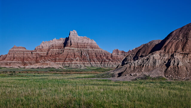Badlands National Park dramatic geological formations under a clear blue sky