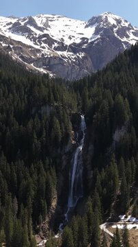 Swiss Alps Iffigfall waterfall near Lenk in the Bernese Oberland region Switzerland, vertical video