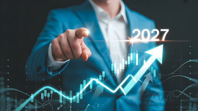 Businessman pointing forward towards 2027 growth chart with rising arrow and financial data