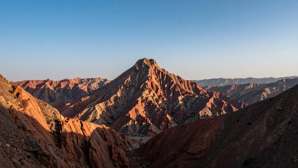 Naklejka premium Zhangye Danxia Landform Mountain Peak at Golden Hour, Majestic Travel Destination and Nature Background