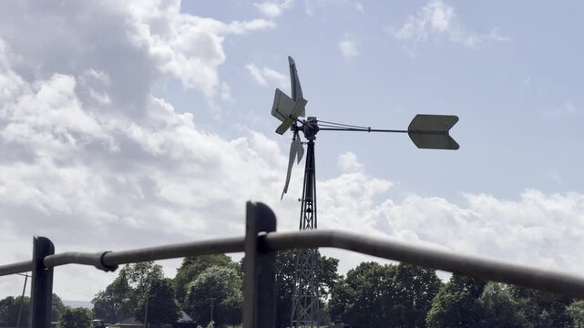 Old farm windmill rotating slow motion